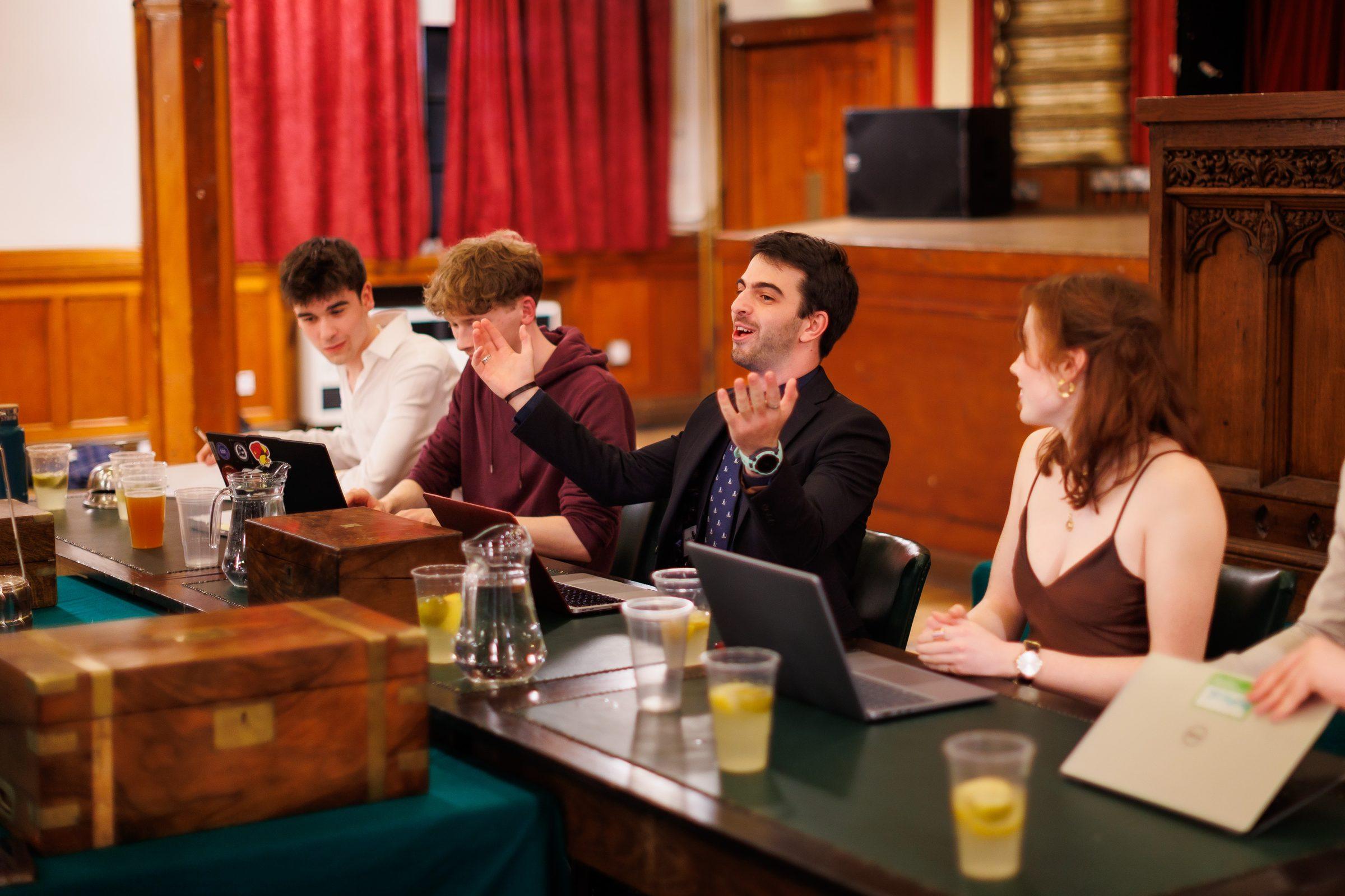 Debaters at the despatch table in the Debating Hall